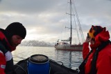 Edd, the second mate, fe­rries Gino back to the  Pelagic.­
