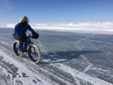 Cycling the ice road, keeping to where there is some snow for grip