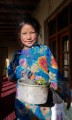 Student at Photoksar, spreading smoke from juniper leaves, a Buddhist morning ritual