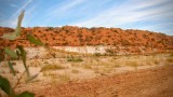 Amazing ochre backdrop to a waterhole (mostly dry)