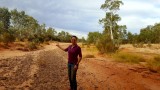 Celebrating reaching the Stuart Highway crossing of the Finke River